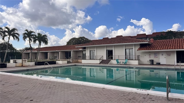 view of swimming pool with a patio