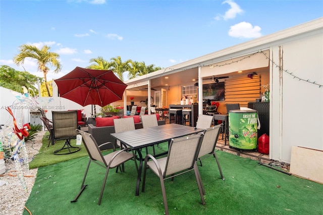 view of patio / terrace with a ceiling fan and outdoor dining area