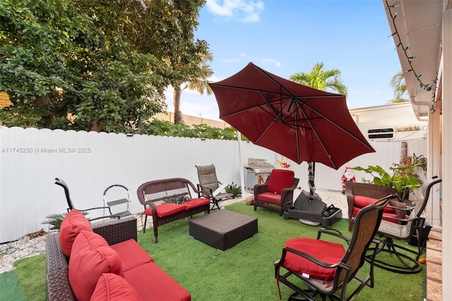 view of patio with outdoor lounge area and fence