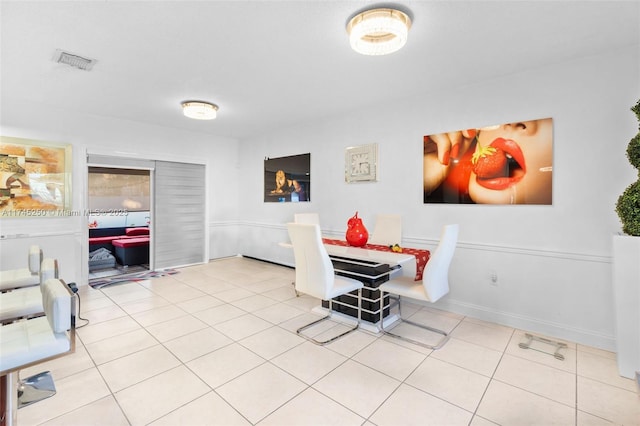 dining space featuring tile patterned flooring and visible vents