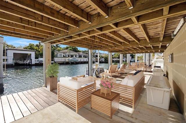 dock area featuring outdoor lounge area and a water view