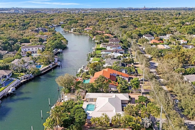 drone / aerial view with a water view and a residential view