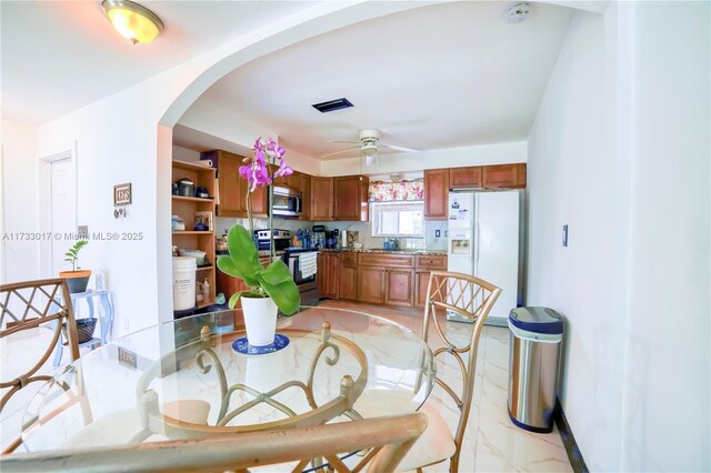 dining area featuring ceiling fan