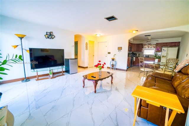 living room with ceiling fan