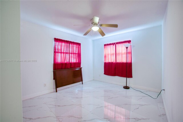 spare room with ceiling fan