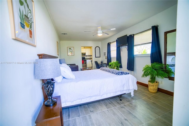 bedroom featuring ceiling fan and a spacious closet