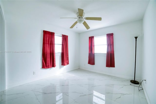 unfurnished room with ceiling fan