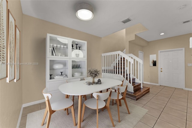 dining space with light tile patterned flooring