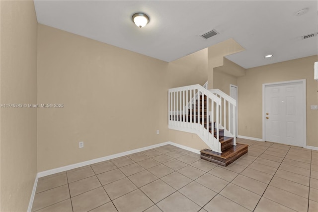 interior space with light tile patterned floors