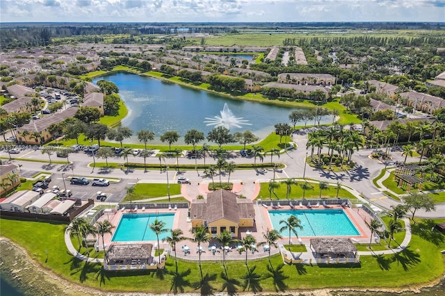 birds eye view of property featuring a water view