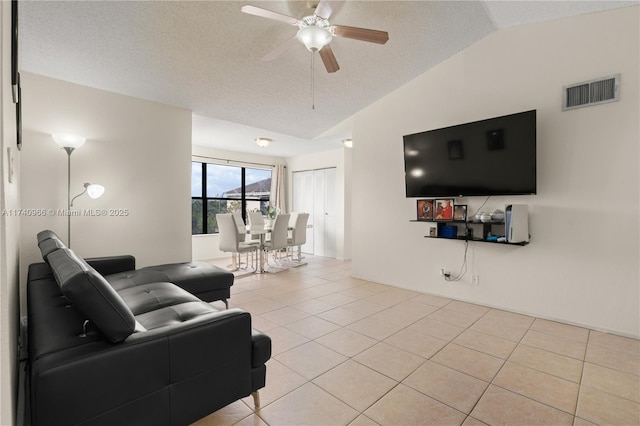 2866 S University Dr Unit 5307, Davie, FL 33328 - living area featuring light tile patterned flooring, a textured ceiling, a ceiling fan, lofted ceiling, and visible vents