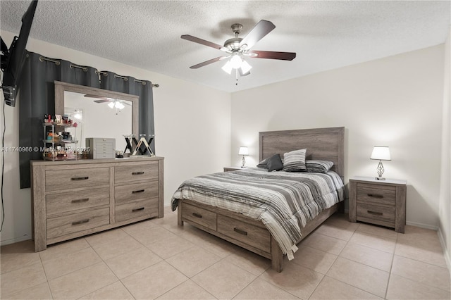 2866 S University Dr Unit 5307, Davie, FL 33328 - bedroom with baseboards, light tile patterned flooring, a textured ceiling, and ceiling fan