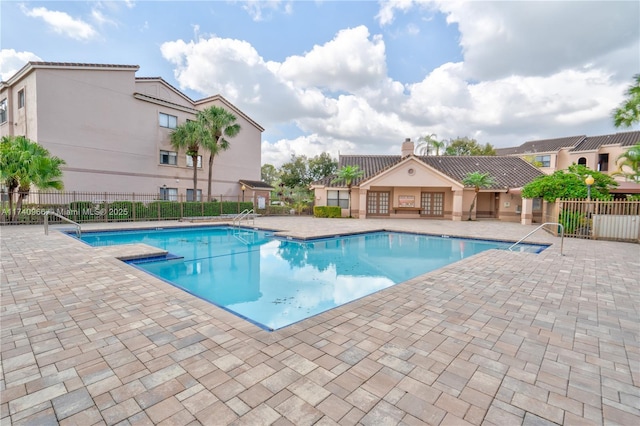 2866 S University Dr Unit 5307, Davie, FL 33328 - community pool with fence and a patio area