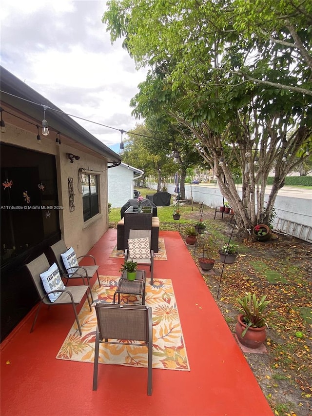 view of patio / terrace featuring fence and an outdoor living space