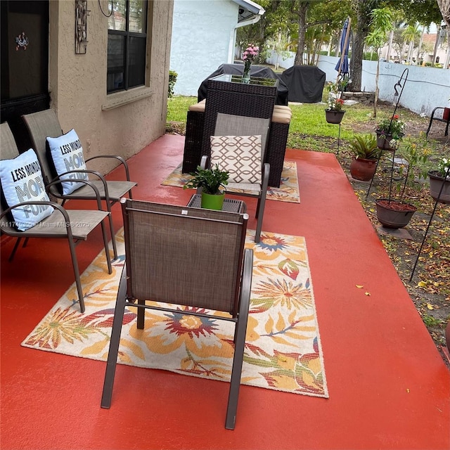 view of patio featuring fence