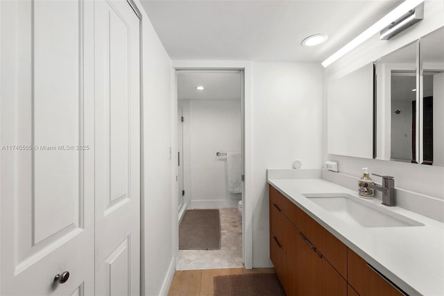 1915 Brickell Ave Unit C1612, Miami, FL 33129 - bathroom with vanity, toilet, a shower stall, recessed lighting, and baseboards