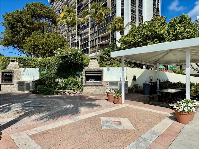 view of patio featuring a fireplace