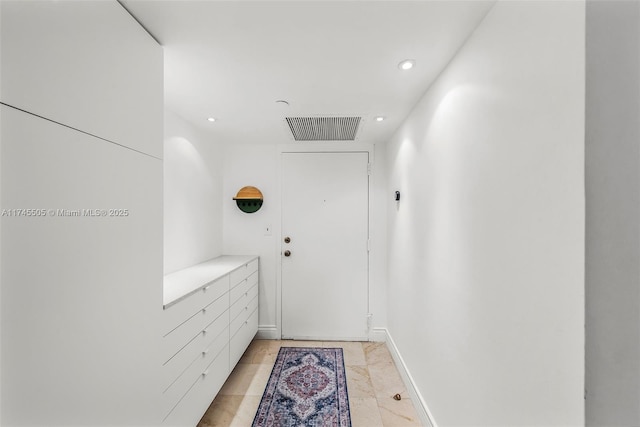 interior space featuring baseboards, visible vents, and recessed lighting