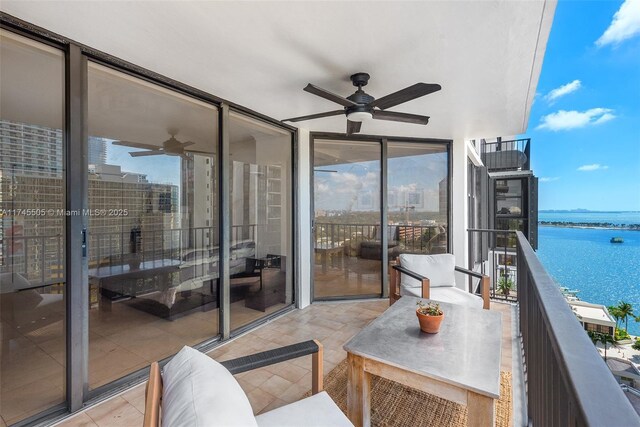 1915 Brickell Ave Unit C1612, Miami, FL 33129 - balcony featuring ceiling fan and a water view