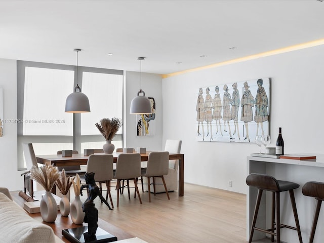 dining space with light wood finished floors