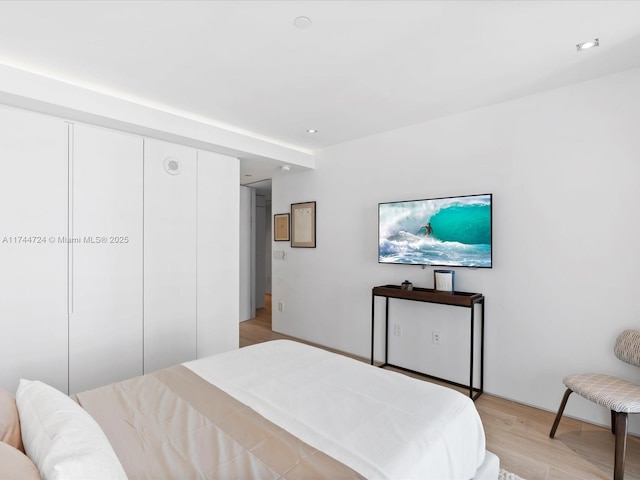 bedroom featuring light wood-style flooring and recessed lighting