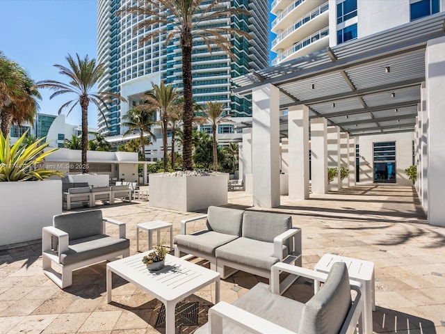 view of patio featuring outdoor lounge area and a pergola