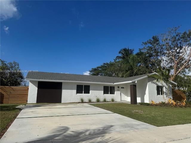 ranch-style house with a front lawn