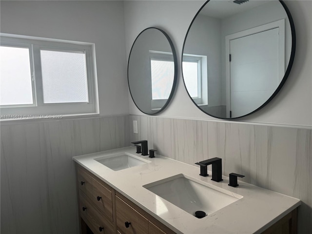 bathroom with plenty of natural light and vanity