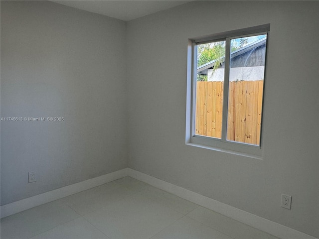 spare room with tile patterned flooring