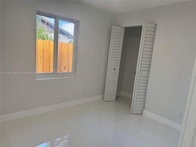 unfurnished bedroom featuring tile patterned floors