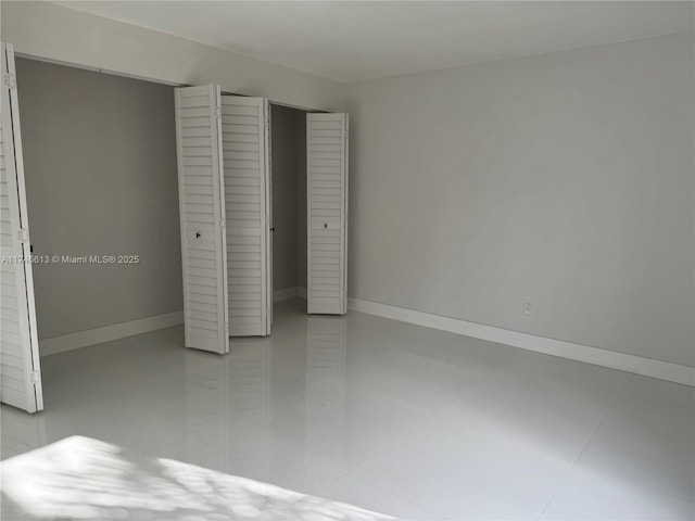 unfurnished bedroom featuring light tile patterned floors