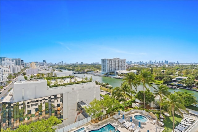 bird's eye view featuring a water view and a city view