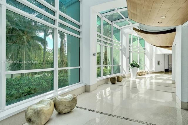 sunroom featuring wooden ceiling