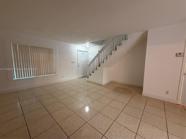 spare room with light tile patterned floors