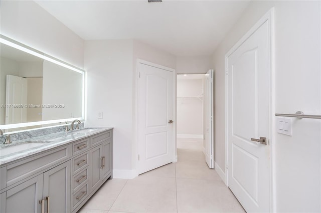 bathroom featuring tile patterned flooring and vanity