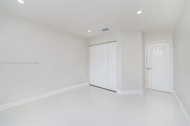 unfurnished bedroom featuring a closet