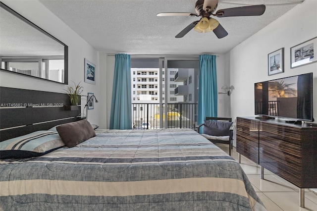 tiled bedroom with ceiling fan, access to outside, and a textured ceiling