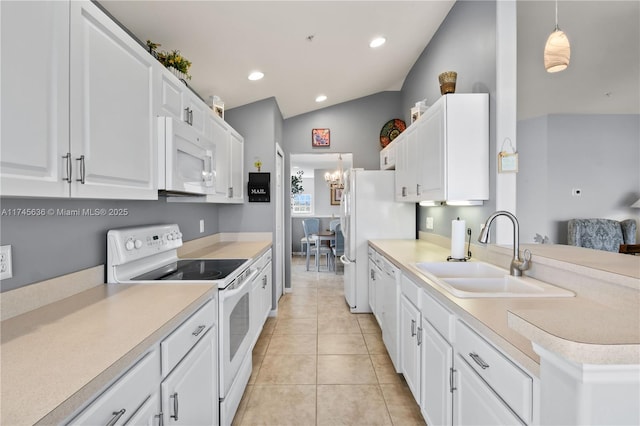 kitchen with sink, white appliances, light tile patterned floors, white cabinetry, and decorative light fixtures