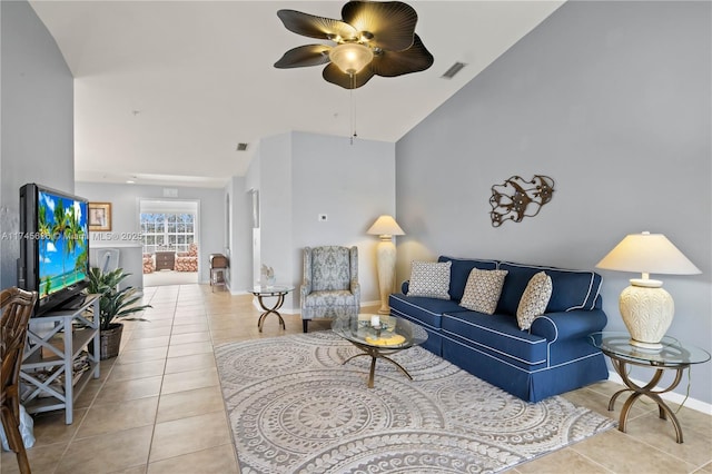 tiled living room featuring high vaulted ceiling and ceiling fan