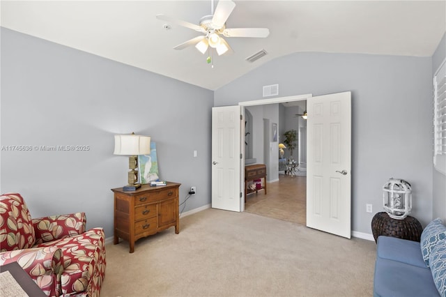 living area featuring ceiling fan, lofted ceiling, and light carpet