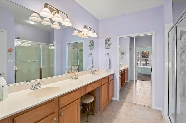 bathroom featuring vanity, tile patterned floors, and walk in shower