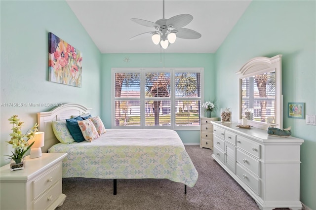 carpeted bedroom with vaulted ceiling and ceiling fan