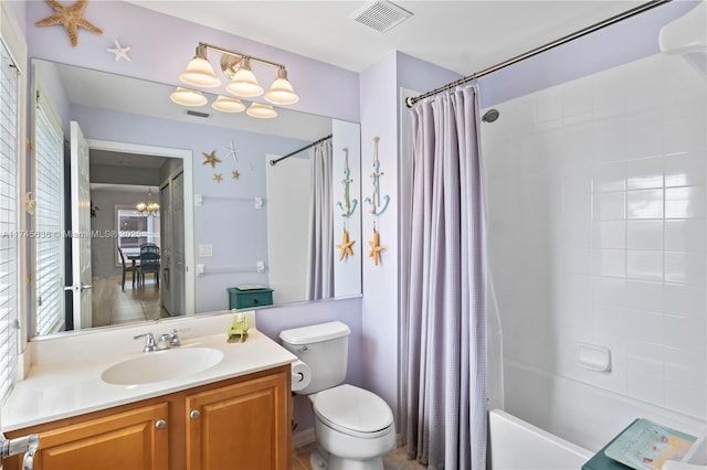 full bathroom with vanity, toilet, and shower / bath combo with shower curtain