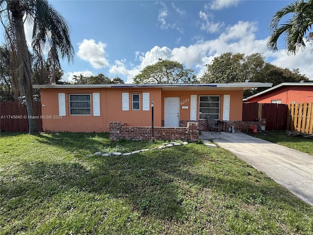 ranch-style home with a front yard