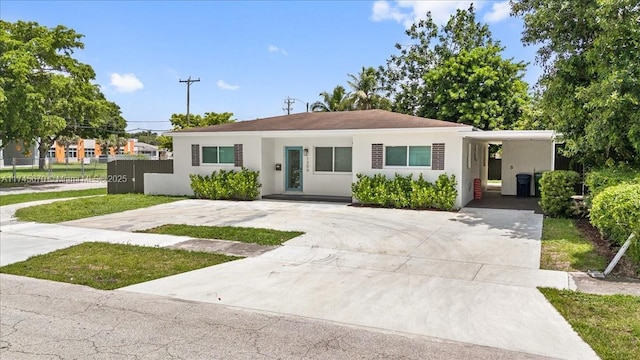 view of front of property featuring a carport