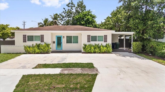 view of front of home featuring a carport