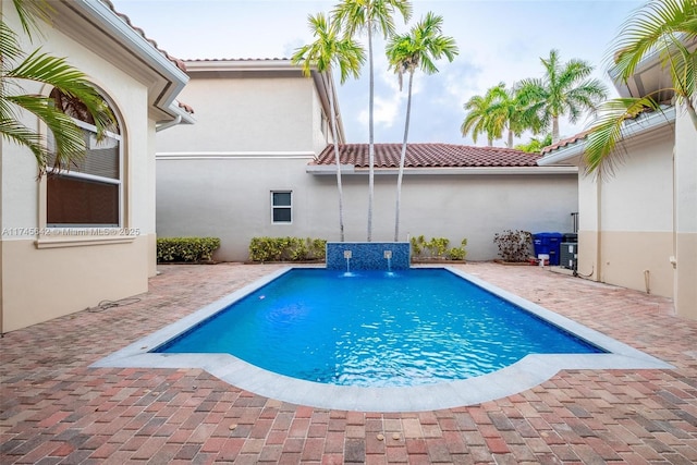 view of swimming pool with a patio