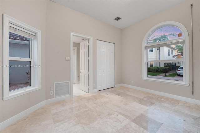 unfurnished bedroom with a closet