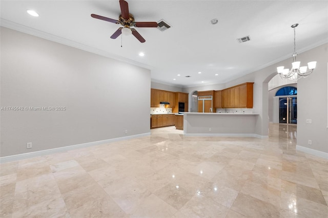 unfurnished living room featuring crown molding and ceiling fan with notable chandelier