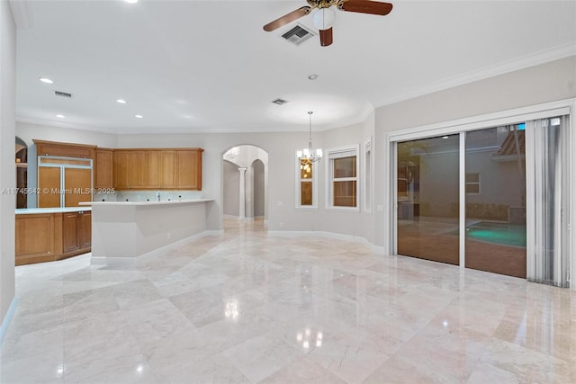 unfurnished living room featuring ornamental molding and ceiling fan with notable chandelier